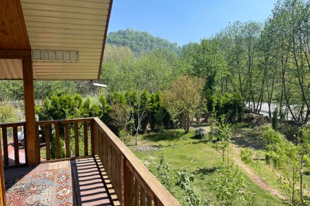 Two-Story Wooden Cabin in Taskuh